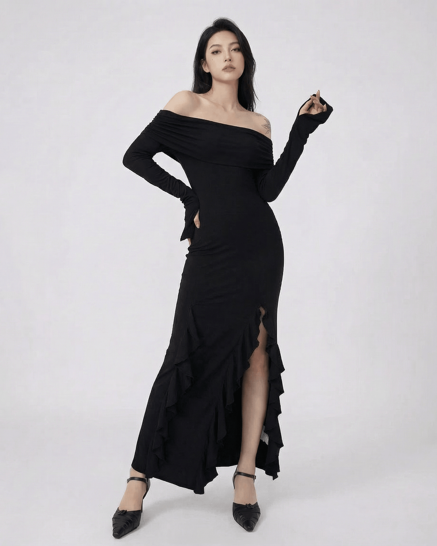 Isis Maxi Dress by RAMBLION, elegant black ankle-length dress, off-shoulder silhouette, asymmetrical ruffle detail.