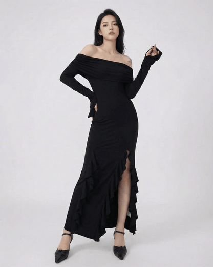 Isis Maxi Dress by RAMBLION, elegant black ankle-length dress, off-shoulder silhouette, asymmetrical ruffle detail.