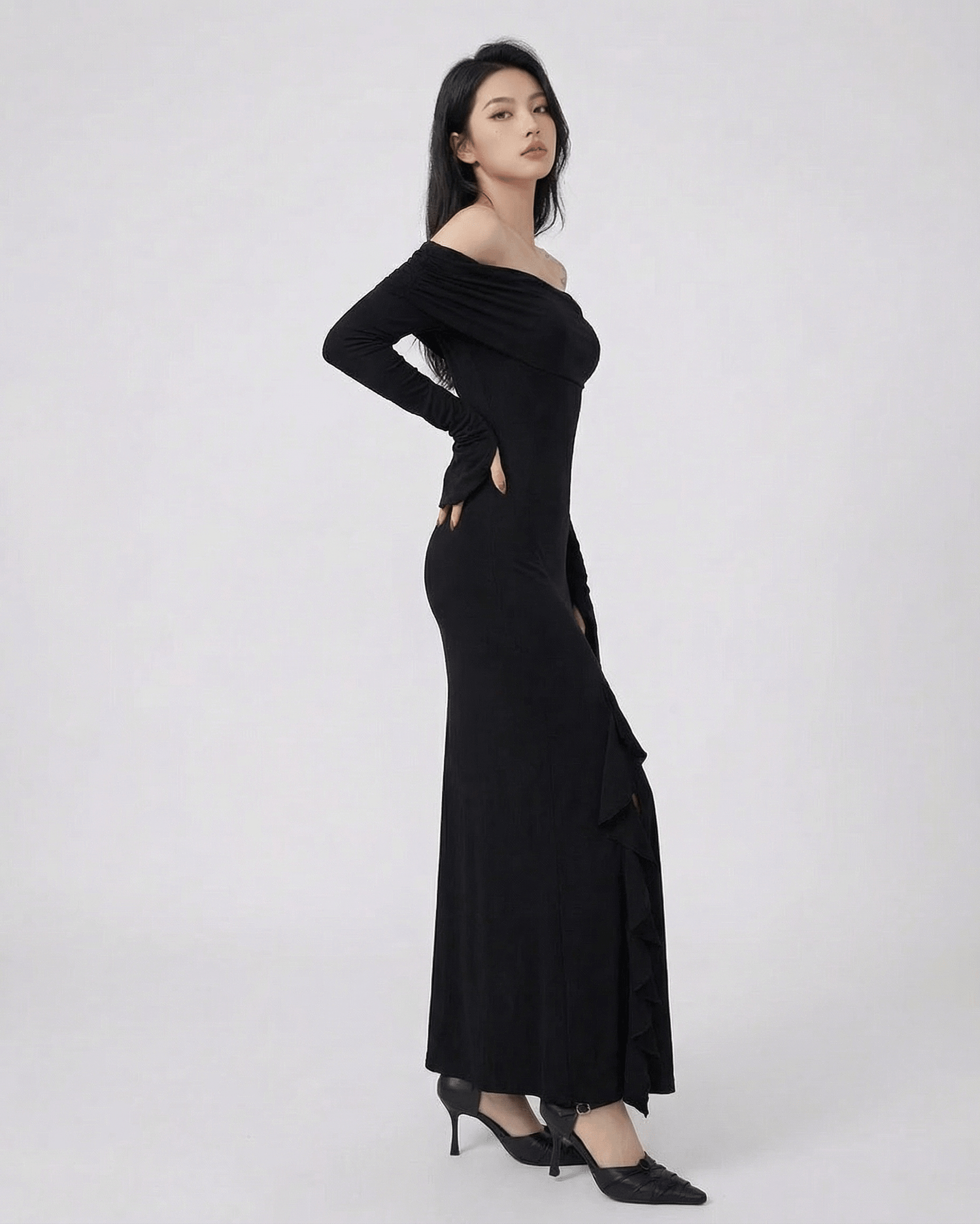 Isis Maxi Dress from RAMBLION, elegant off-shoulder black dress with asymmetrical ruffle, perfect for special occasions.