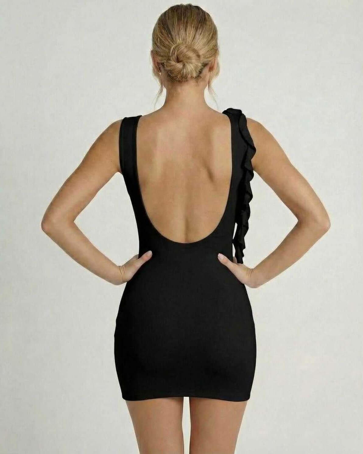 Isit Mini Dress by RAMBLION, black mini dress with ruffled shoulder, elegant back design, ideal for sophisticated occasions.
