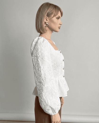 Ivory Corset Top by RAMBLION, featuring jacquard fabric and puff sleeves, showcasing a refined and elegant look.
