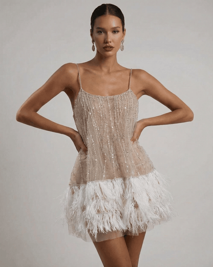 Jara Mini Dress featuring sequined bodice and feathered trim, perfect for glamorous occasions, by RAMBLION.