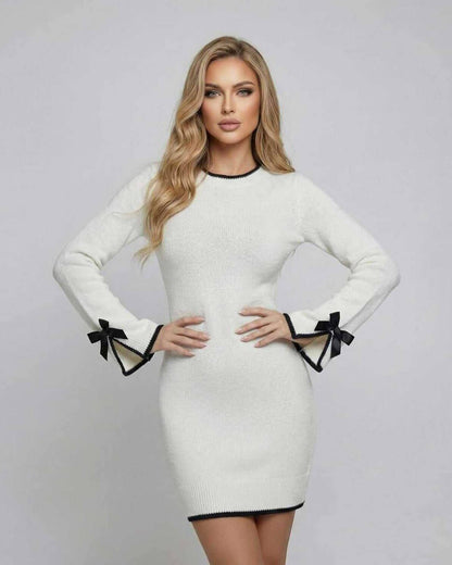 Kami Mini Dress in white with black trim, round neck, and chic design by RAMBLION, perfect for any occasion.