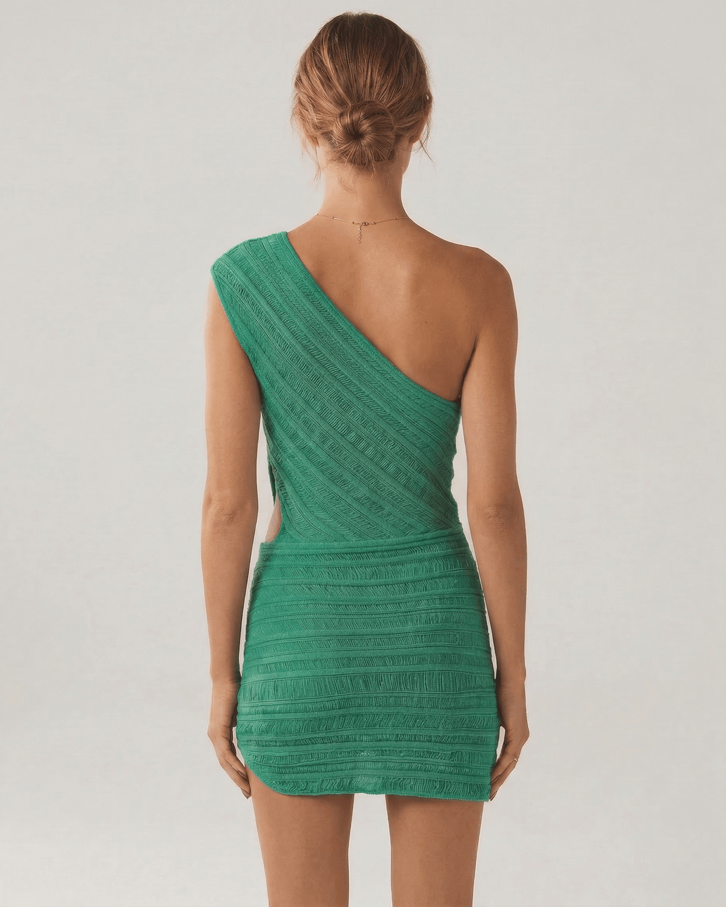Keva Mini Dress by RAMBLION, one-shoulder design, vibrant green color, perfect for summer occasions.