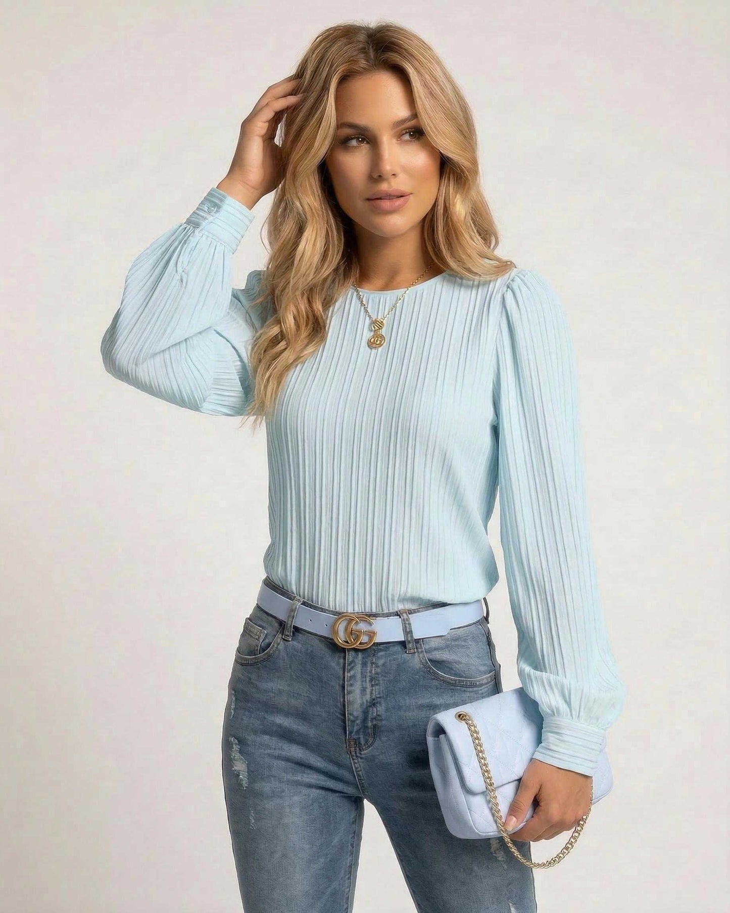 Kima Blouse by RAMBLION in light blue, featuring soft pleats, perfect for casual occasions with a luxurious feel.