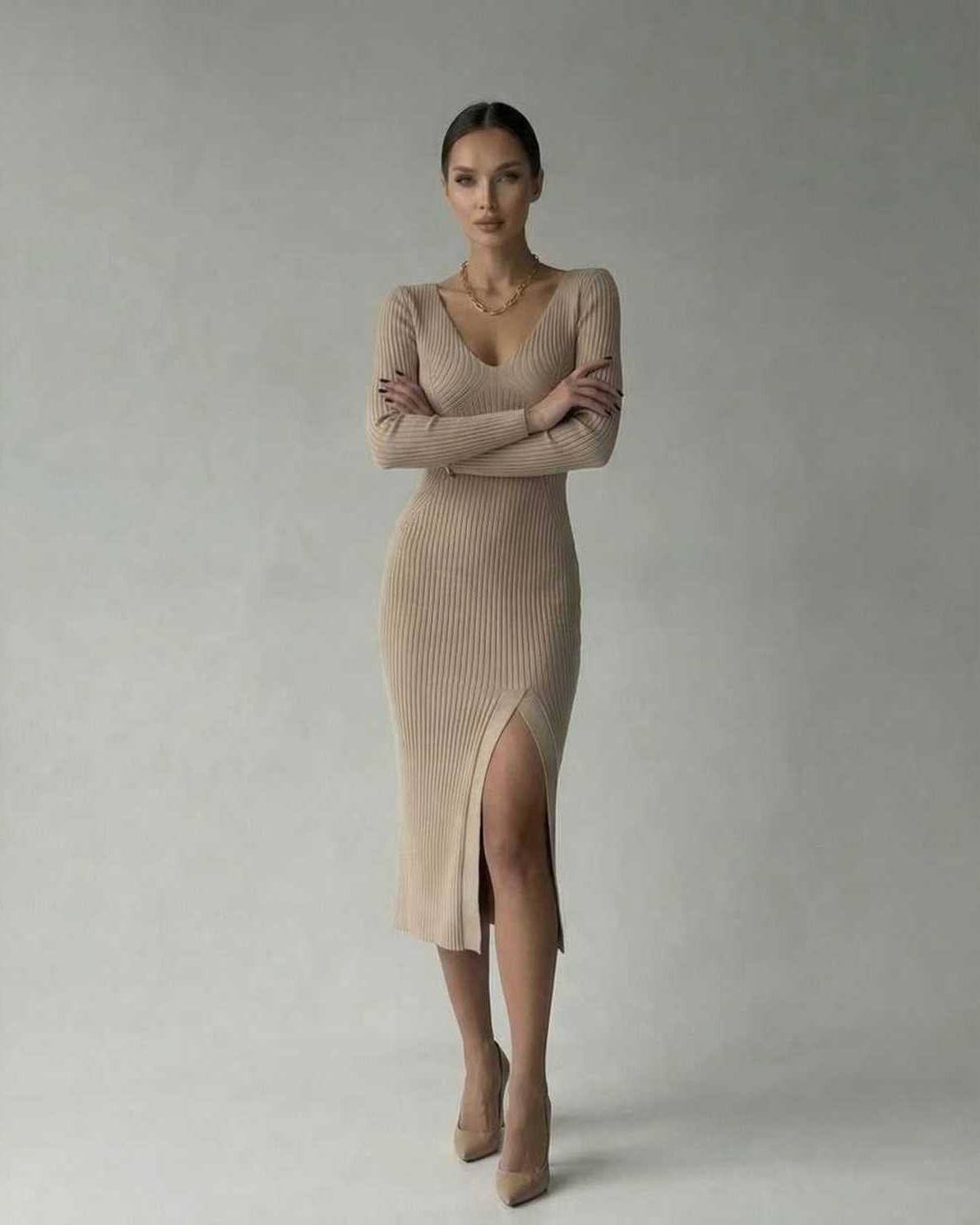 Kira Midi Dress in beige, featuring V neck and ribbed knit, perfect for sophisticated occasions by RAMBLION.