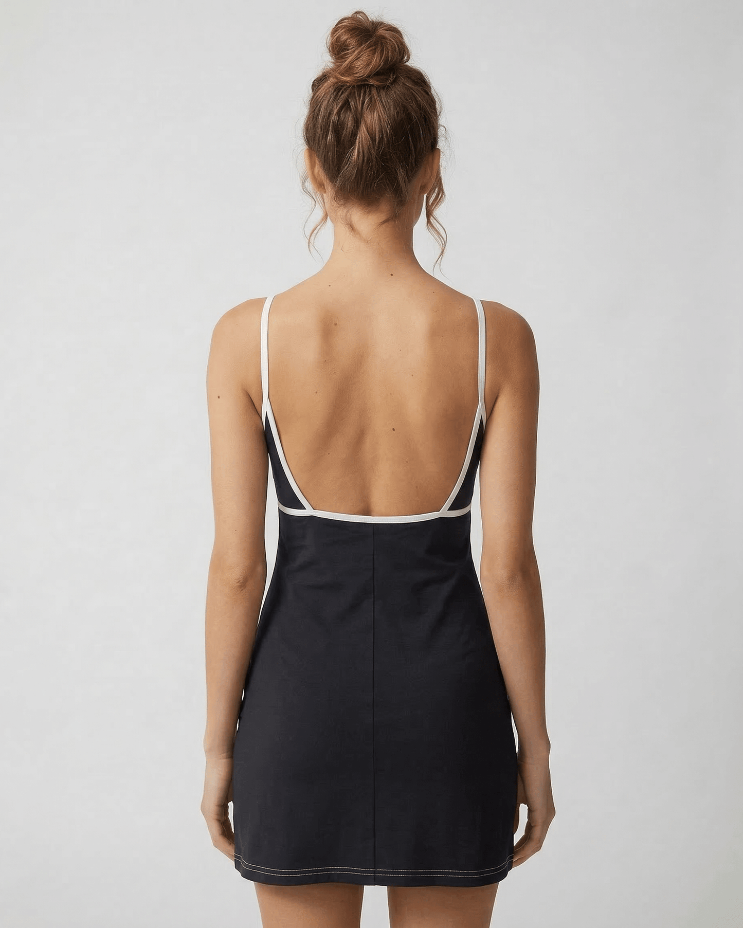 Kola Mini Dress by RAMBLION in black, featuring a V neck and cut-out detail, perfect for stylish occasions.