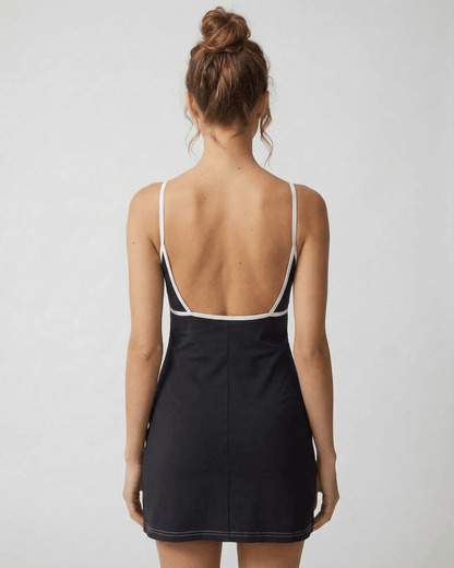 Kola Mini Dress by RAMBLION in black, featuring a V neck and cut-out detail, perfect for stylish occasions.