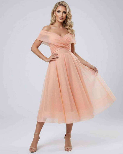 Kome Midi Dress by RAMBLION in soft peach, off-shoulder style, perfect for modern elegance at special occasions.