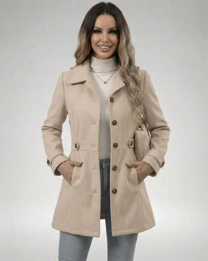 Woman wearing the Latte Sculpt Jacket, a beige slim fit jacket with a tailored silhouette and comfortable design.