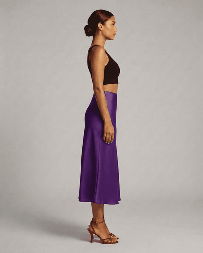 Amethyst Midi Skirt by RAMBLION showcased on a model, highlighting its elegant silhouette and rich purple color.