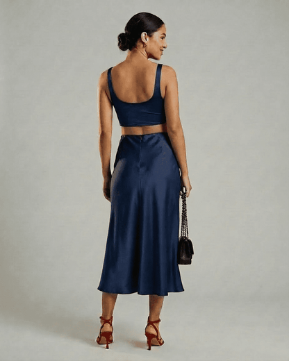 Astra Midi Skirt by RAMBLION - elegant satin mermaid midi skirt in deep navy blue, showcasing a sleek silhouette.