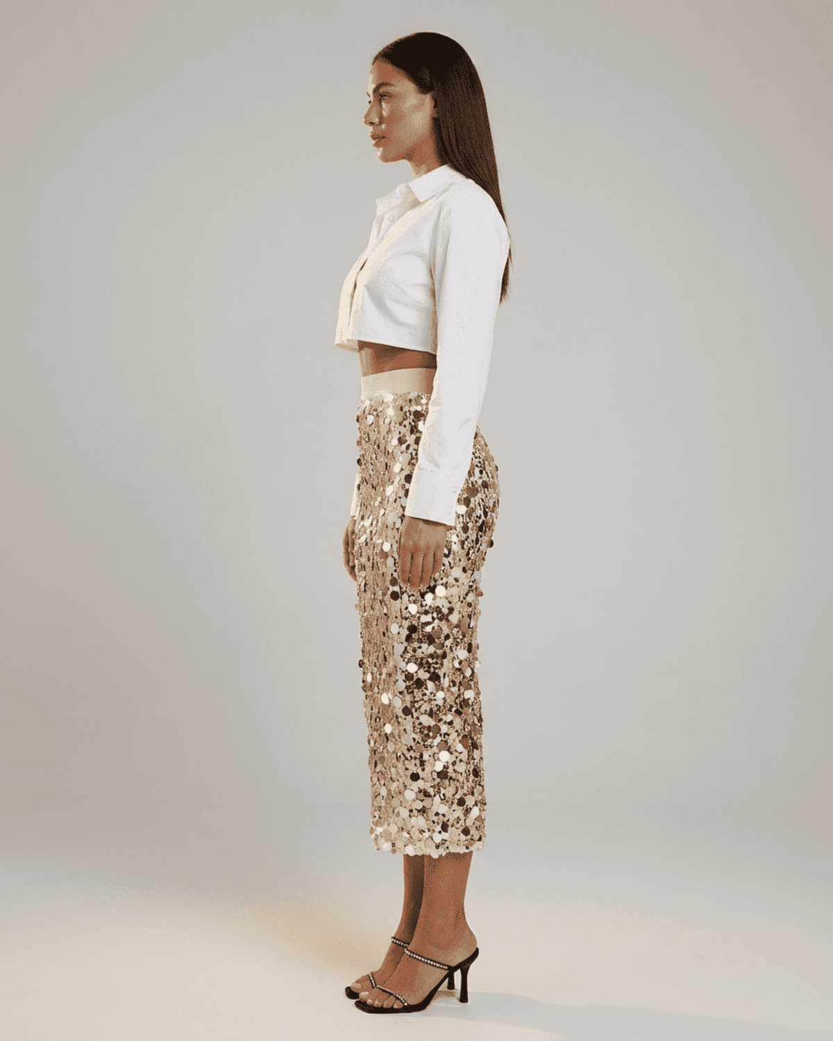 Aureline Midi Skirt by RAMBLION: Sequin high waist bodycon midi skirt showcased on model in profile view.