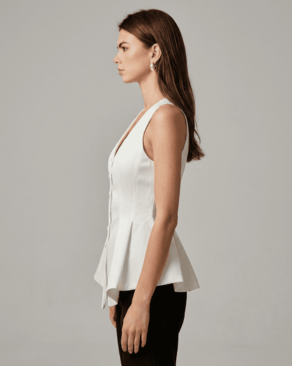 Celeste Blouse by RAMBLION, a stylish satin tailored sleeveless v-neck blouse showcasing a refined silhouette.