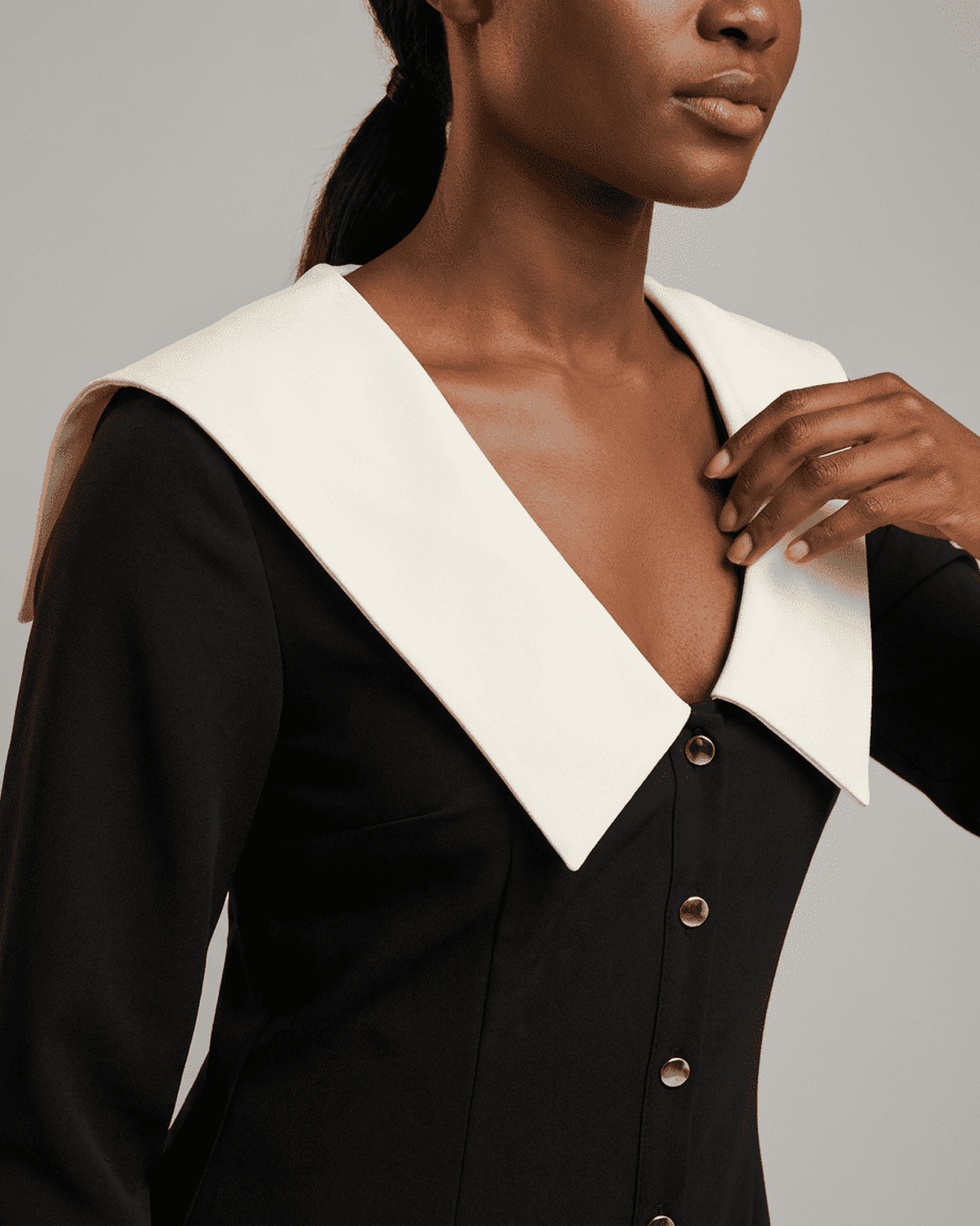 Corinne Mini Dress by RAMBLION featuring a classic wide collar and contrasting black and white color block design.