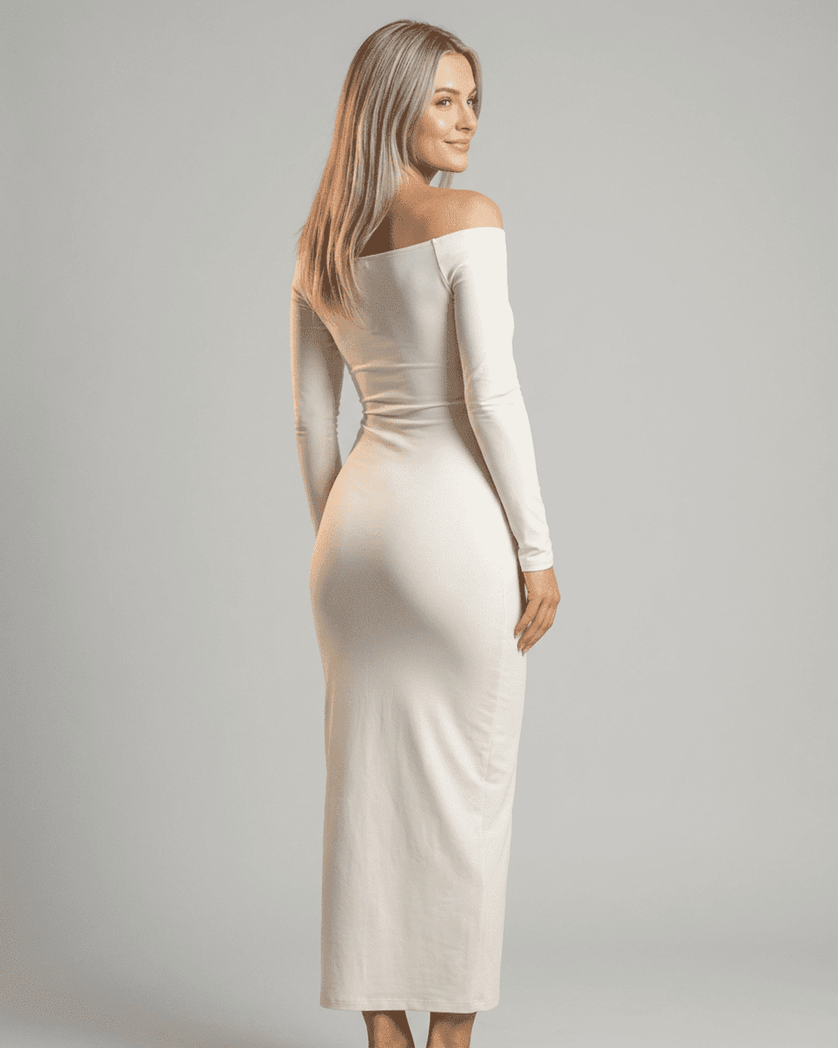 Ivory Maxi Dress by RAMBLION, featuring an off-shoulder slash neck and long sleeves, styled elegantly from the back.