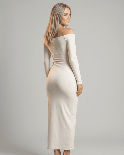 Ivory Maxi Dress by RAMBLION, featuring an off-shoulder slash neck and long sleeves, styled elegantly from the back.
