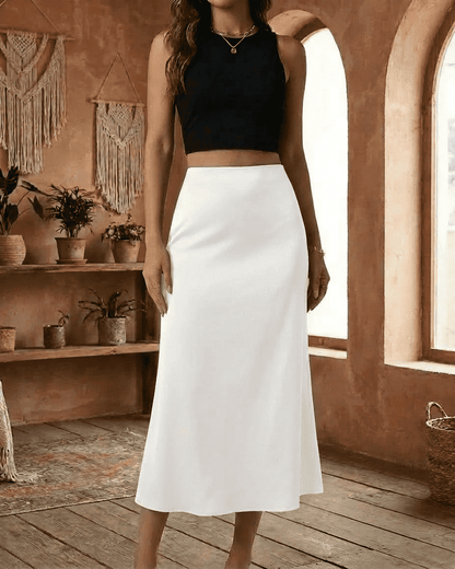 RAMBLION Luna Midi Skirt in elegant white, paired with a stylish black crop top for chic summer outfits.