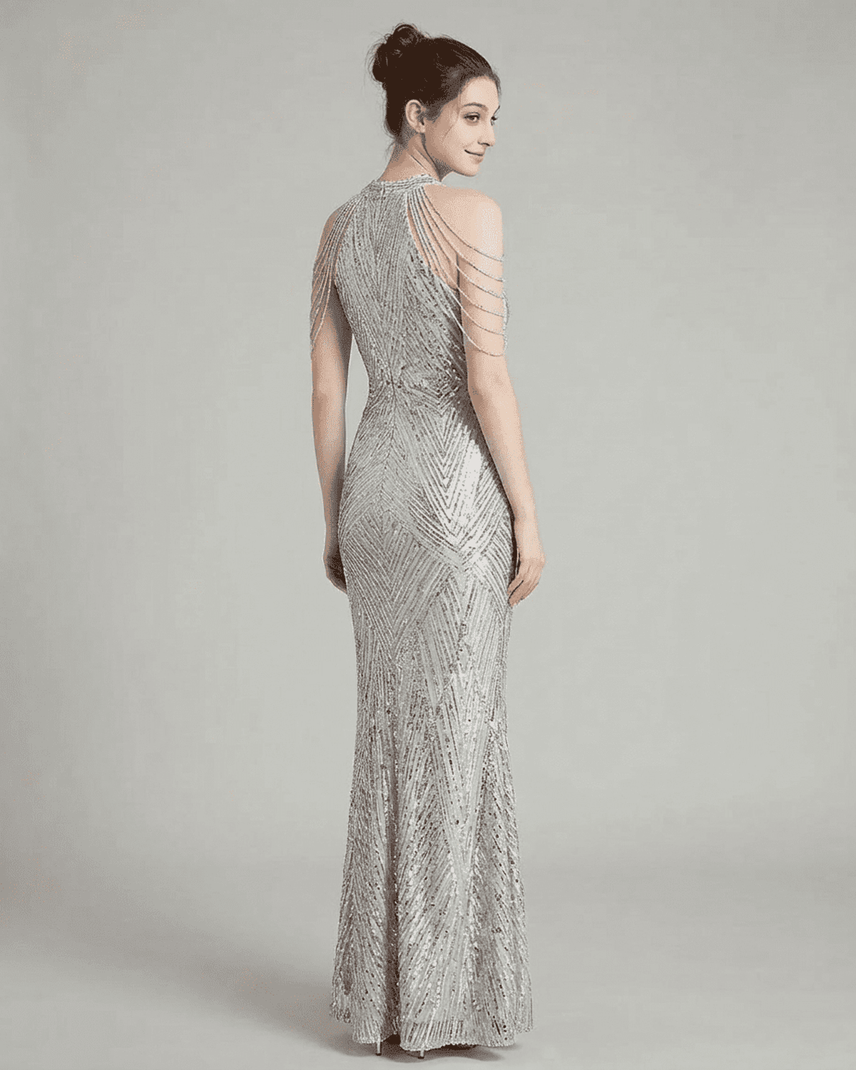 Luxe Maxi Dress by RAMBLION, showcasing a silver sequin mermaid gown with elegant beaded shoulder drapes.