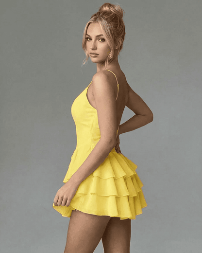 Marigold Mini Dress by RAMBLION, featuring a stylish tiered ruffle design and adjustable spaghetti straps.