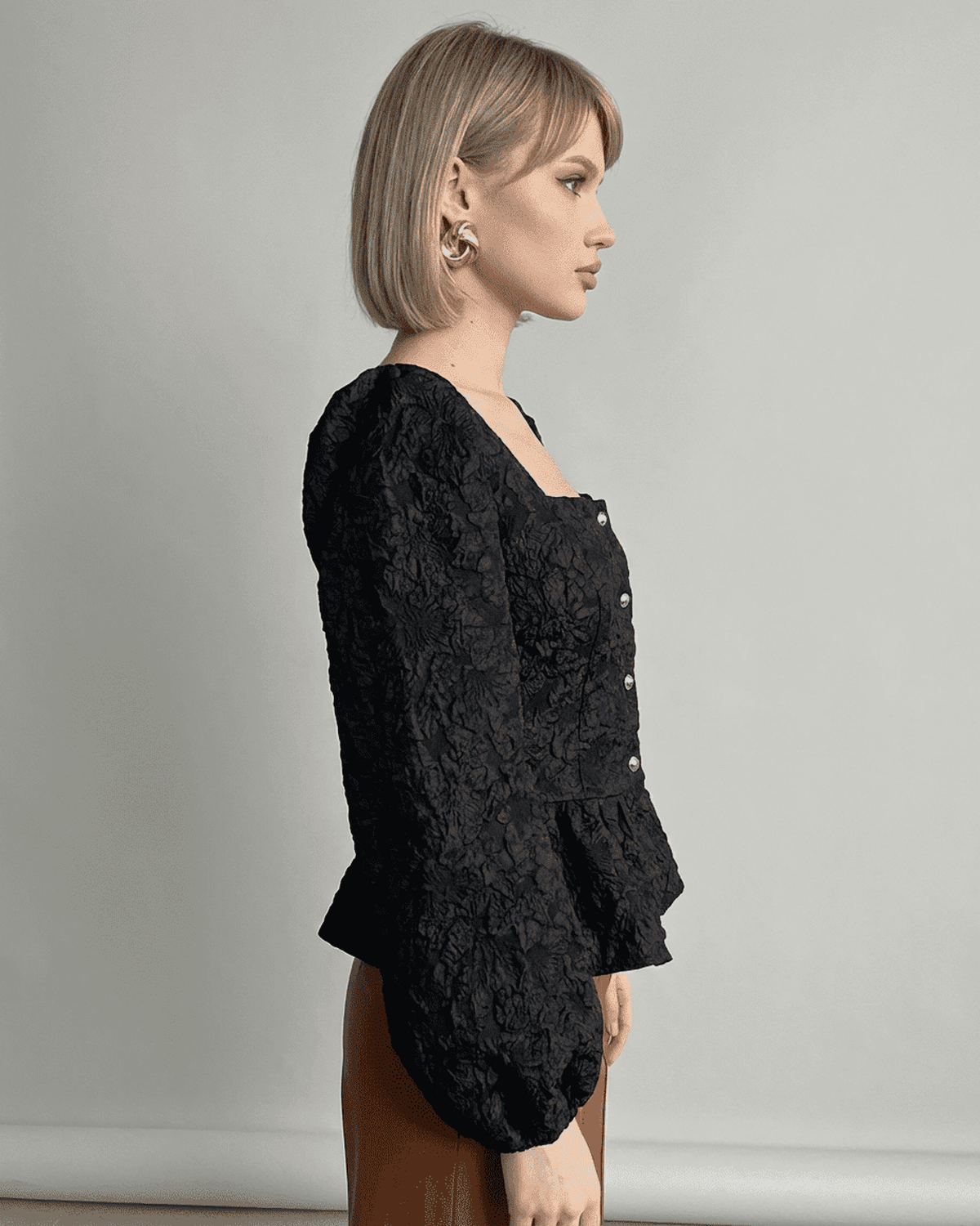 Noir Corset Top by RAMBLION - Jacquard blouse with puff sleeves and square neckline, showcasing fine craftsmanship.