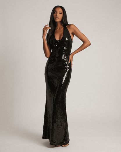 Noiré Maxi Dress by RAMBLION features a backless V-neck silhouette with floral sequin detail and a shimmering black finish.