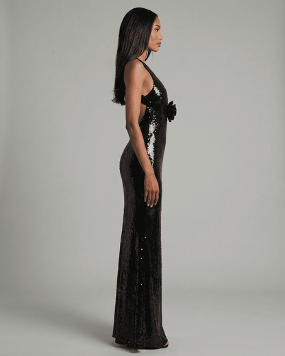 Noiré Maxi Dress from RAMBLION featuring a backless V-neck silhouette and striking floral sequin detail.
