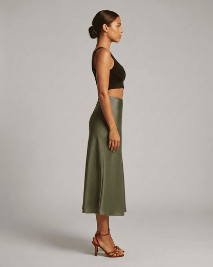 Olivia Midi Skirt by RAMBLION in olive green, showcasing elegant satin mermaid silhouette from the side.