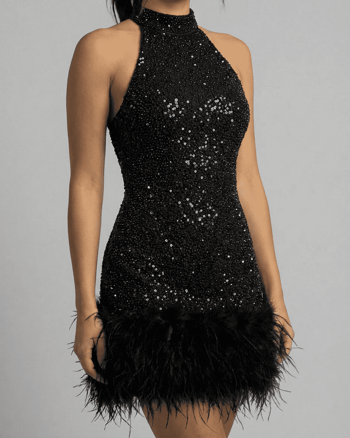 Onyx Mini Dress by RAMBLION - Black sequin halter bodycon mini dress with fuzzy hem, showcasing sleek silhouette and shimmer.