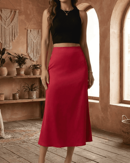 Rosalia Midi Skirt by RAMBLION – Elegant red satin mermaid midi skirt showcasing a modern feminine silhouette.