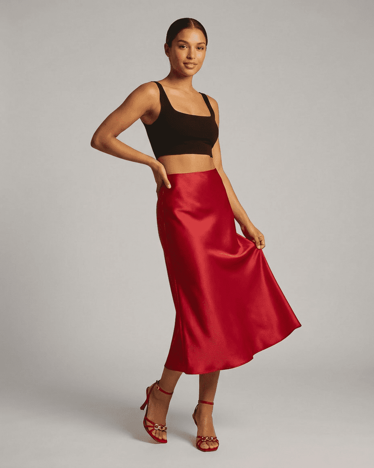 Rosalia Midi Skirt by RAMBLION showcasing a satin mermaid design in red for an elegant look.
