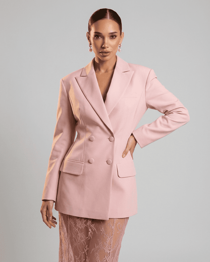 Rosalie Blazer by RAMBLION, a pink double-breasted women's blazer showcasing a tailored silhouette and sharp lapels.
