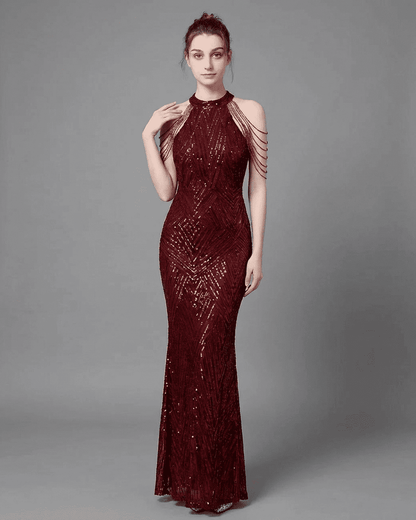 Ruby Maxi Dress by RAMBLION, a glamorous halter mermaid gown in deep red with sequins and elegant shoulder drapes.