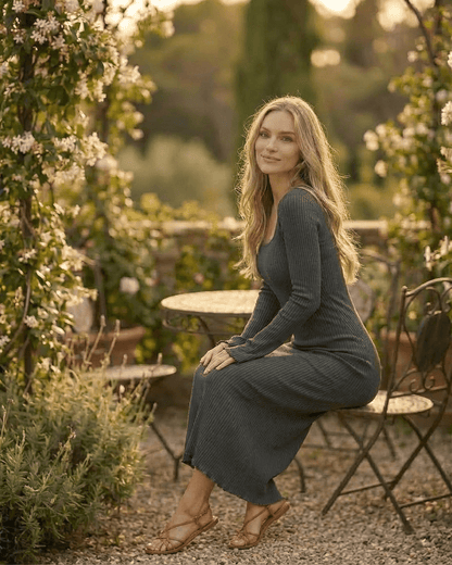 Slate Maxi Dress by RAMBLION, featuring a ribbed knit design with a square neckline and long sleeves in a natural setting.