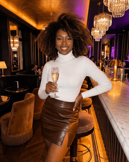 Umbria Mini Skirt by RAMBLION showcased by a model in a stylish setting, featuring a high-waisted PU A-Line design.