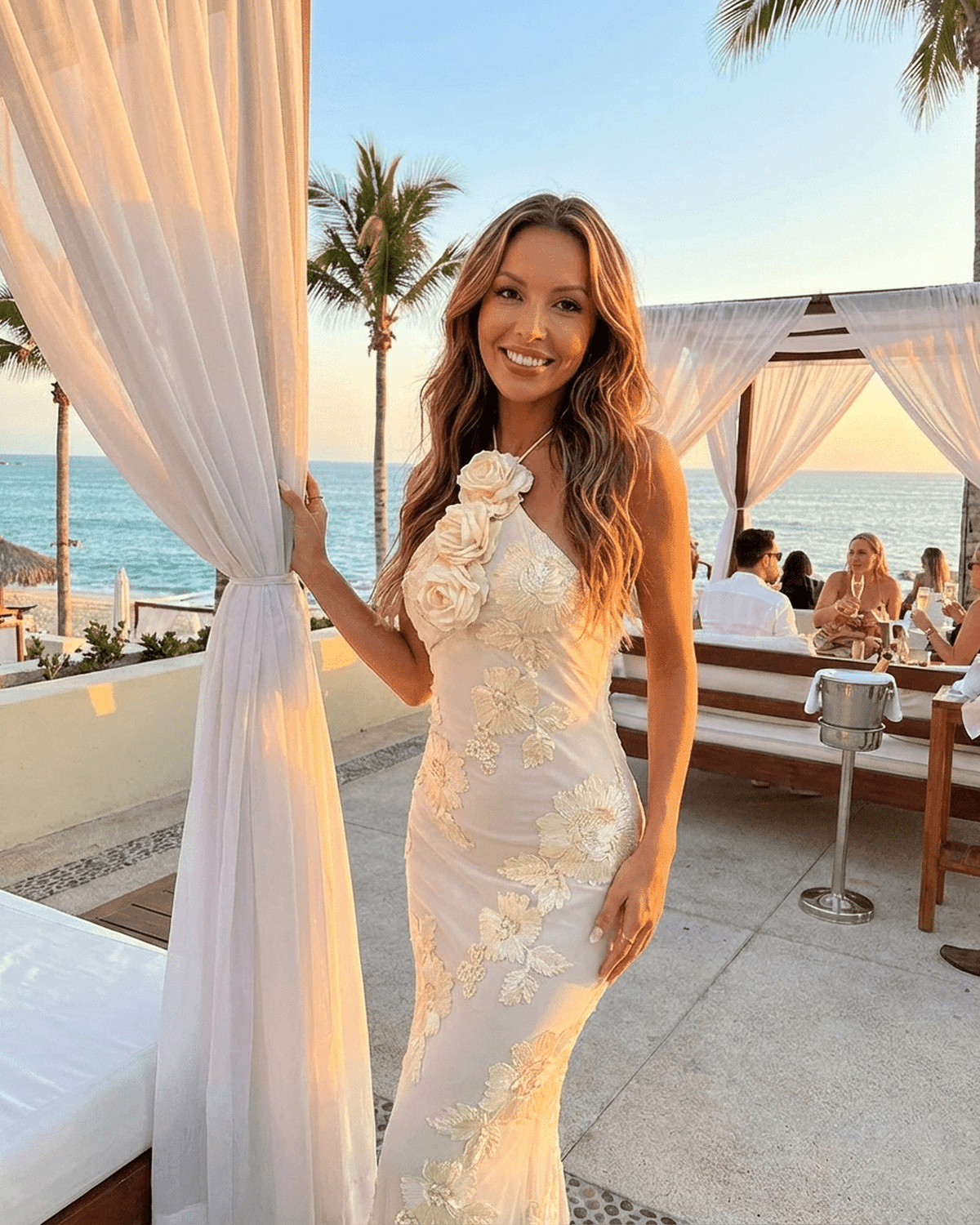 Valeria Maxi Dress by RAMBLION, halter neck with 3D floral foil print, perfect for beachside elegance.
