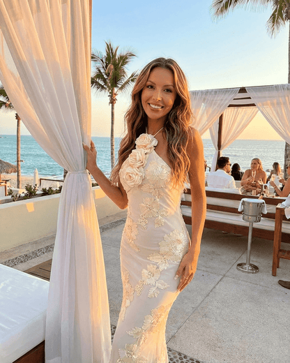 Valeria Maxi Dress by RAMBLION, halter neck with 3D floral foil print, perfect for beachside elegance.