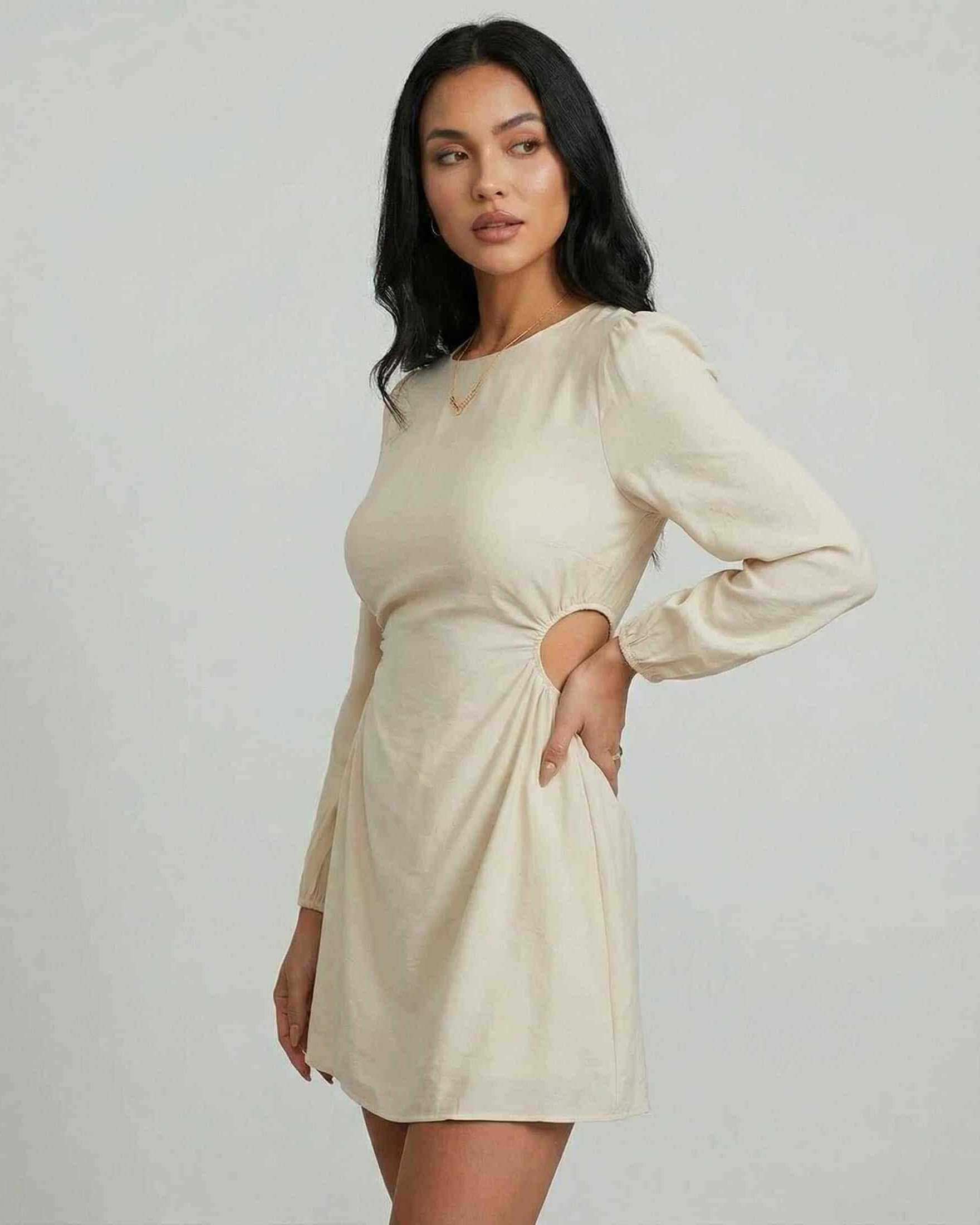 Lava Mini Dress by RAMBLION, beige with side cut-outs, perfect for autumn and winter, elegant women's fashion.