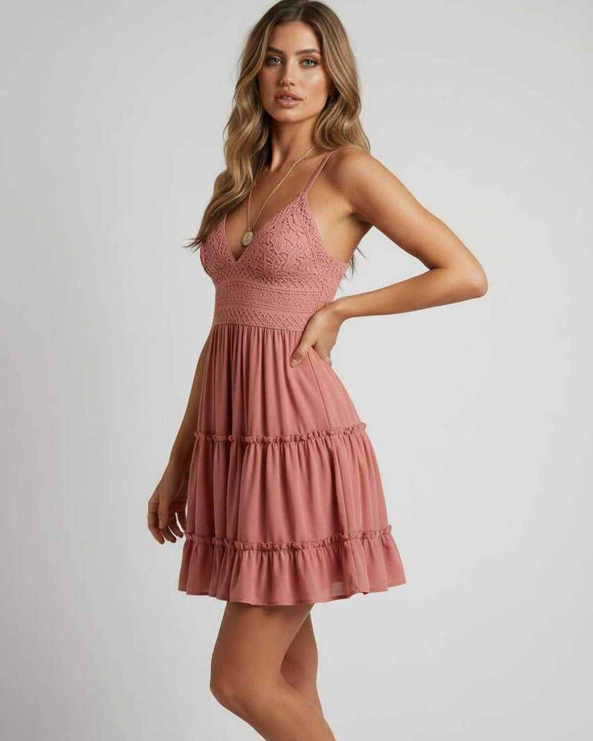 Laya Mini Dress in pink, featuring a V neck, lace overlay, and pleated skirt, perfect for parties by RAMBLION.