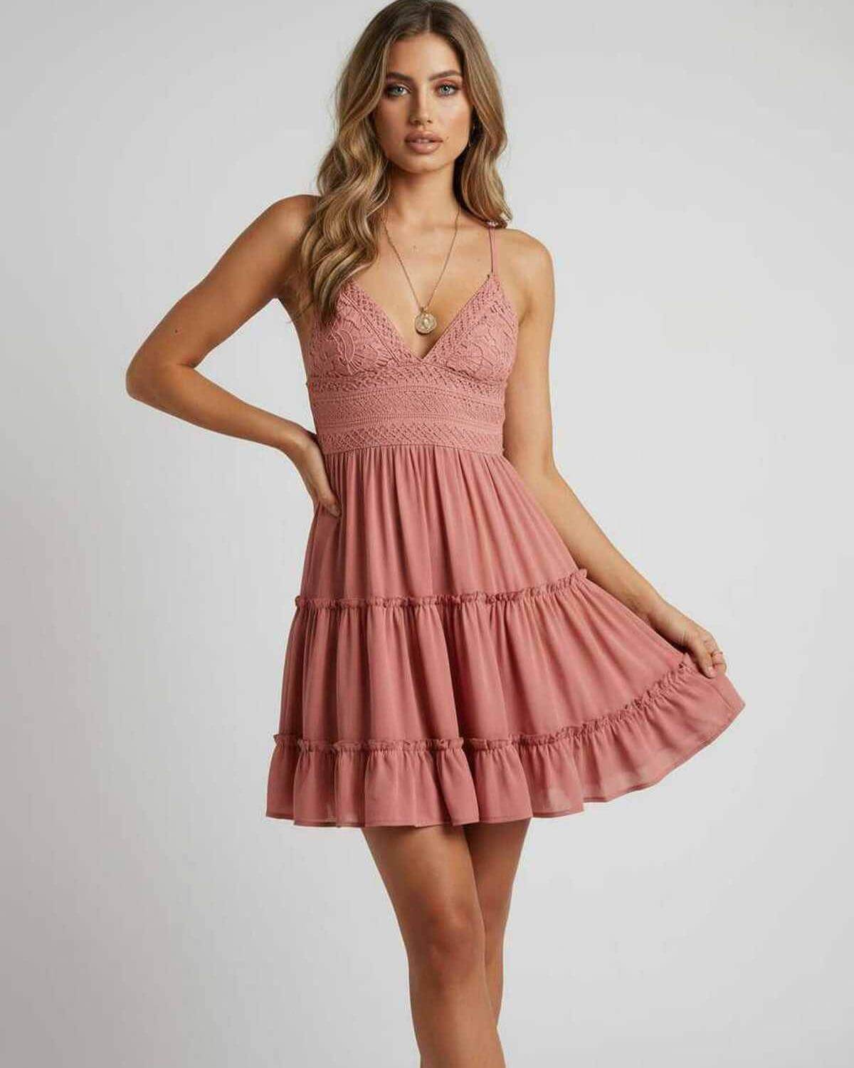 Laya Mini Dress in pink with lace overlay, pleated skirt, perfect for parties and evening events by RAMBLION.