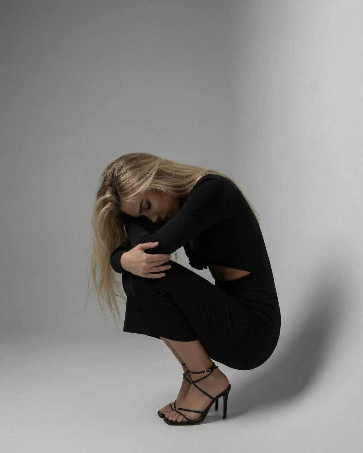 Levanzo Midi Dress in black with stylish silhouette, V-neck detail, perfect for elegant occasions by RAMBLION.