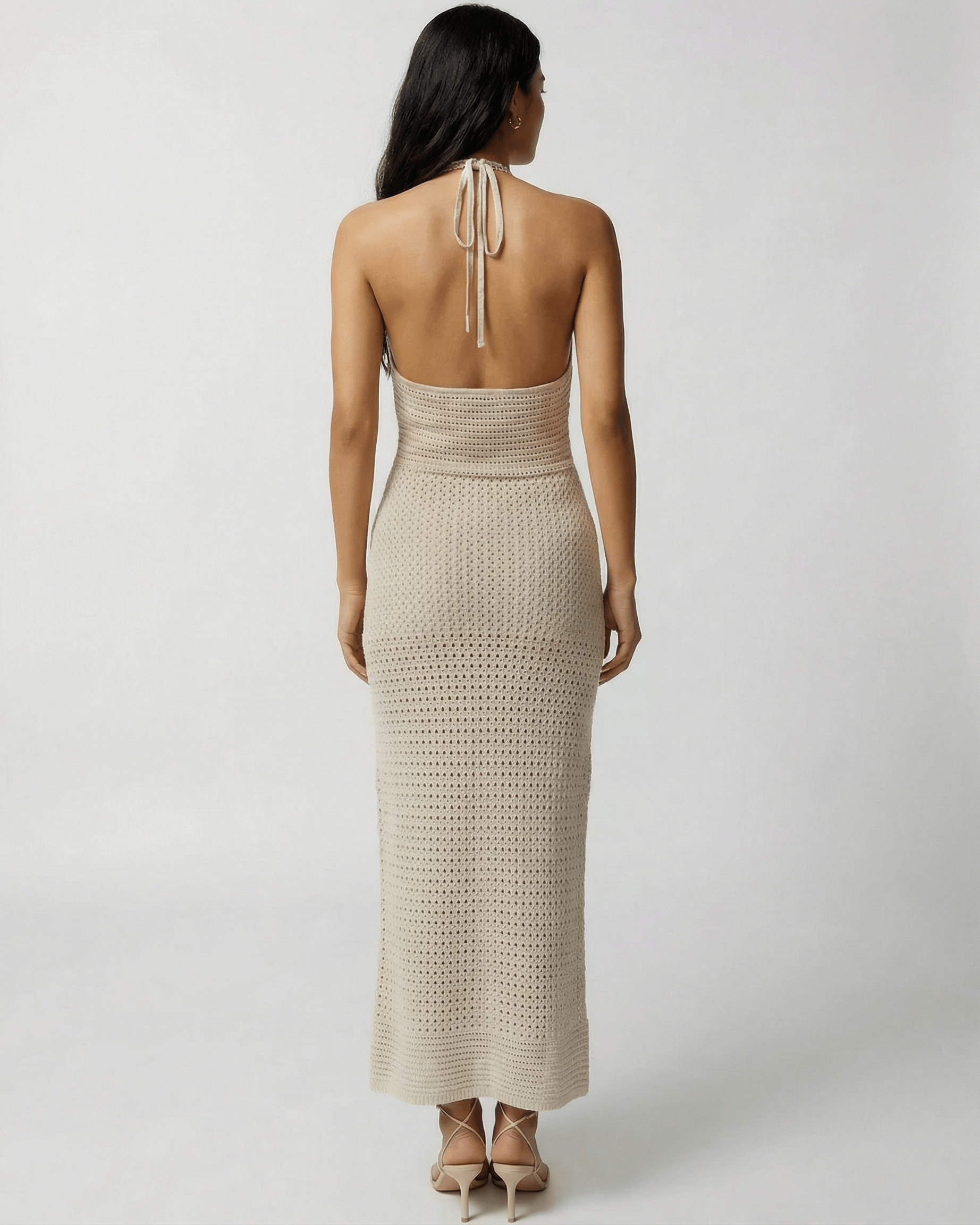 Back view of Lova Maxi Dress in beige with halter neck, perfect for warm weather outings - RAMBLION.