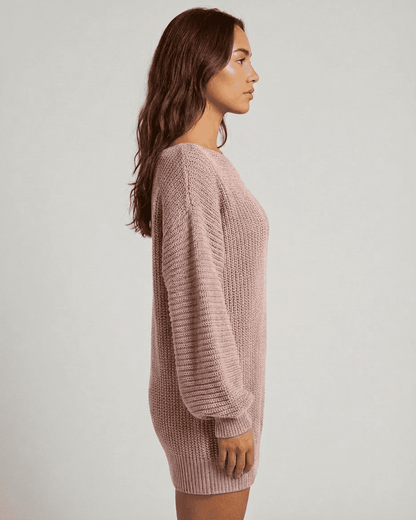 Lova Mini Dress by RAMBLION in soft pink ribbed knit, featuring round neck and chic asymmetrical silhouette.