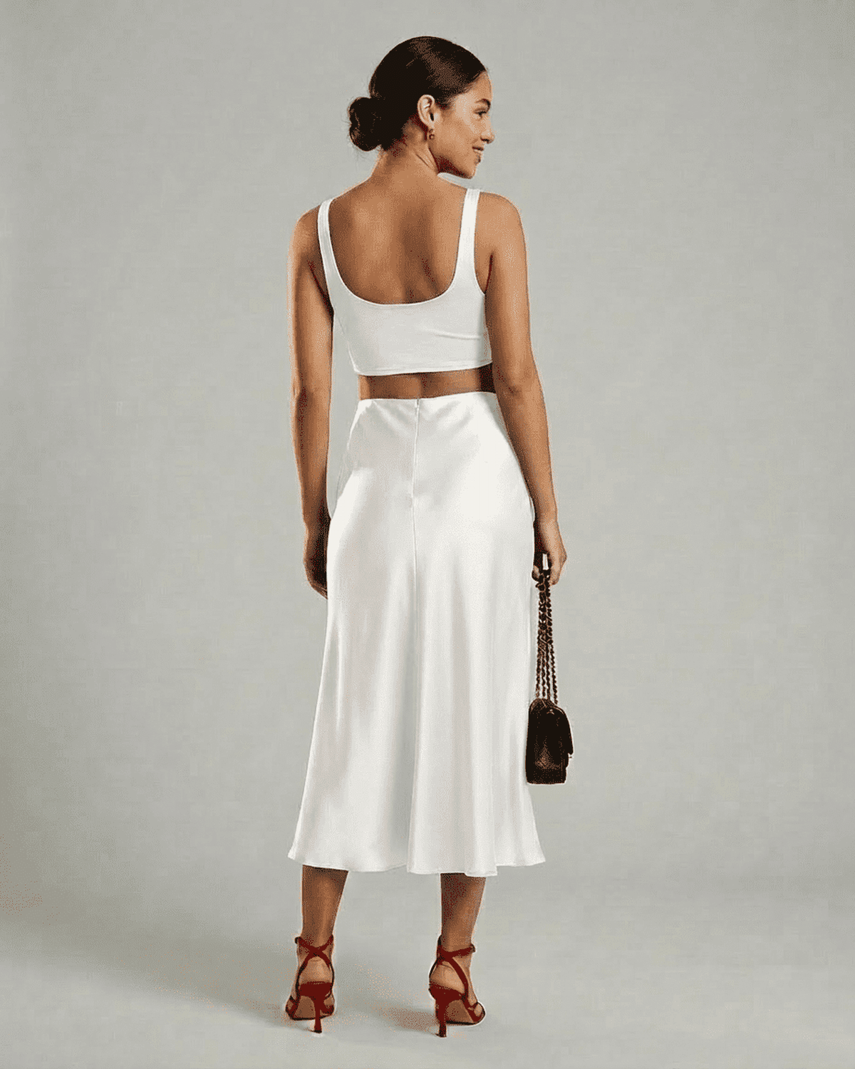 Luna Midi Skirt in white satin, elegant mermaid silhouette, showcasing modern sophistication by RAMBLION.
