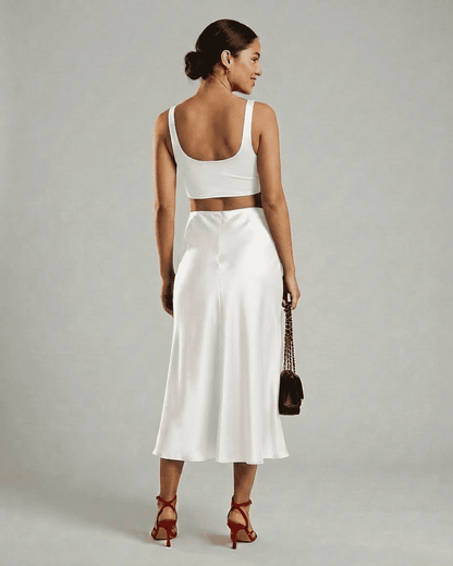 Luna Midi Skirt in white satin, elegant mermaid silhouette, showcasing modern sophistication by RAMBLION.