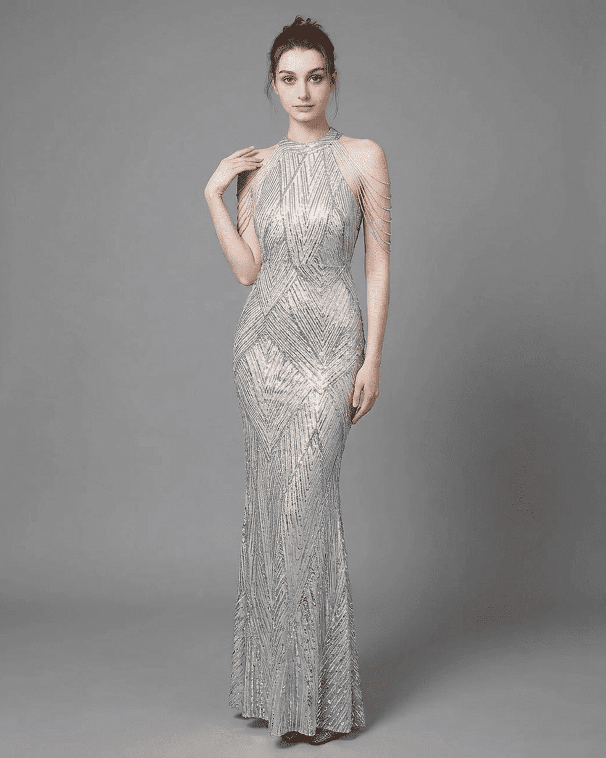 Luxe Maxi Dress by RAMBLION, featuring a silver sequin mermaid gown with halter neckline and beaded shoulder drapes.