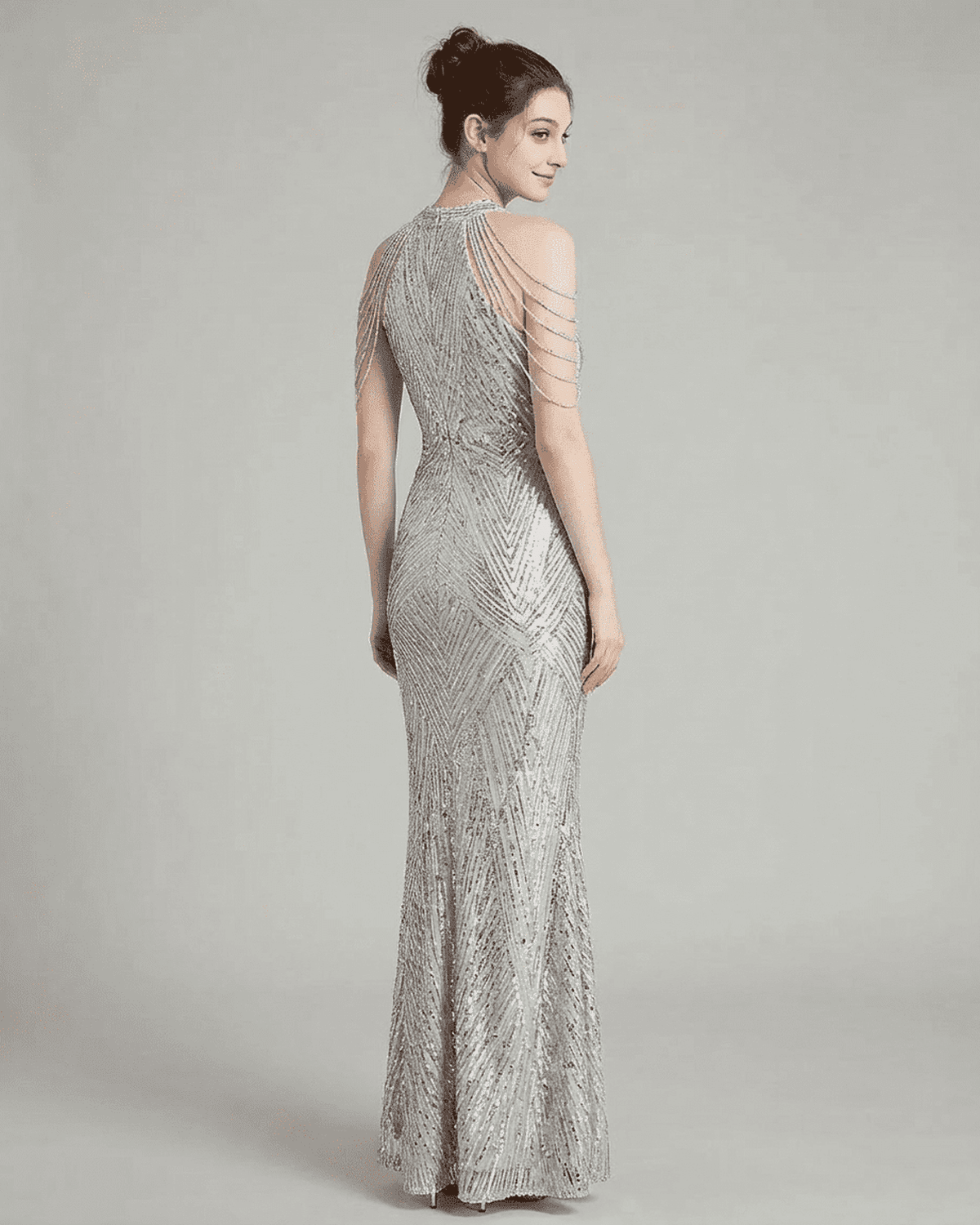 Luxe Maxi Dress showcasing a silver velvet mermaid gown with intricate sequins and beaded shoulder drapes.