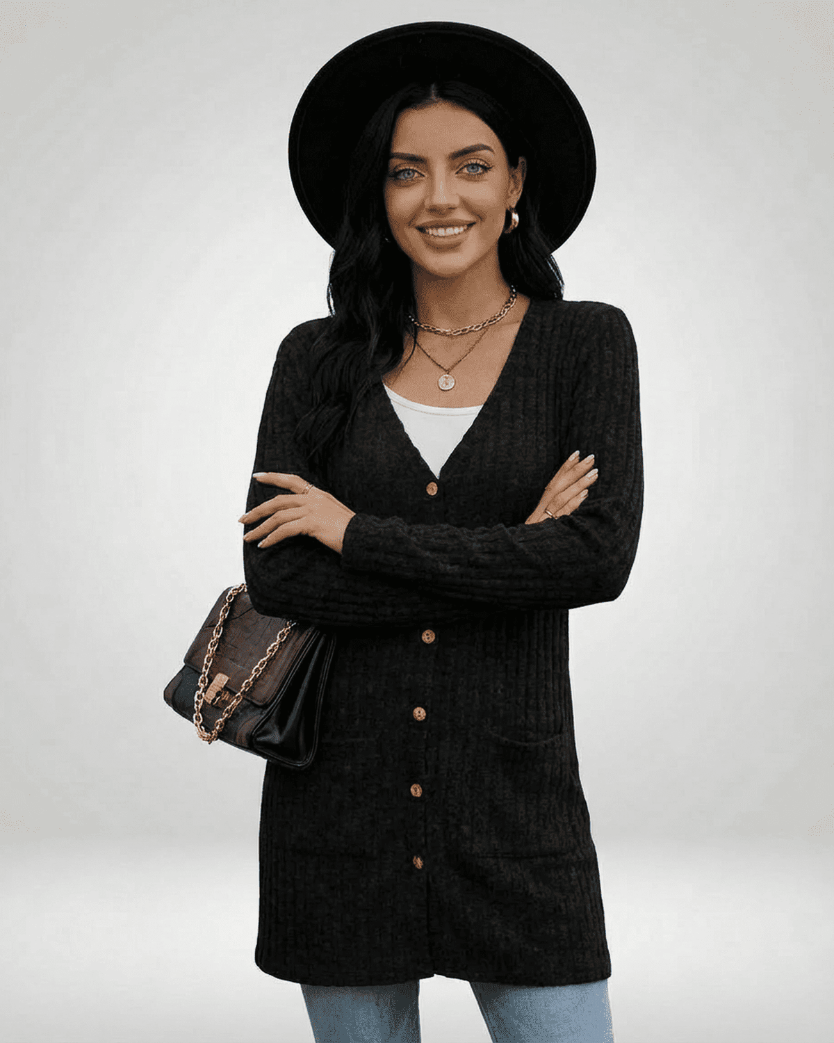 Madu Cardigan in black, featuring a V-neck, ribbed design, perfect for layering and casual occasions from RAMBLION.