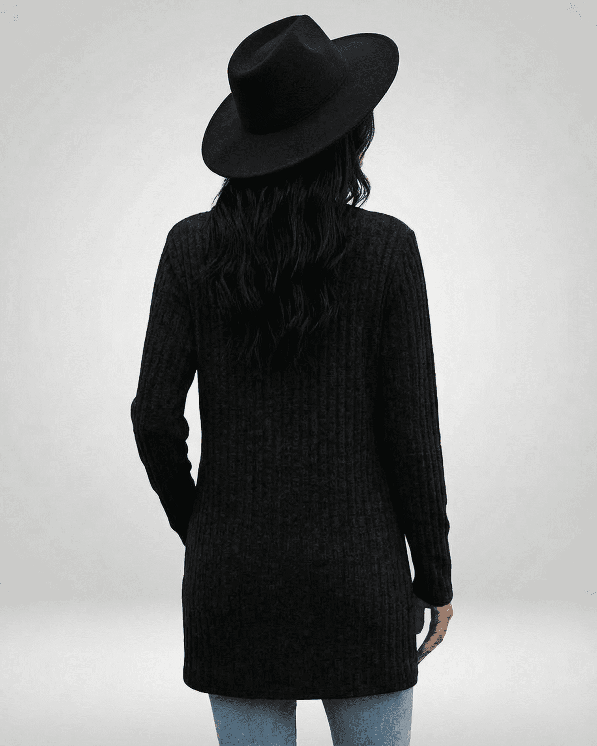 Madu Cardigan in black, featuring a longline silhouette and V-neck, perfect for layering by RAMBLION.