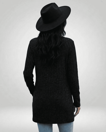 Madu Cardigan in black, featuring a longline silhouette and V-neck, perfect for layering by RAMBLION.